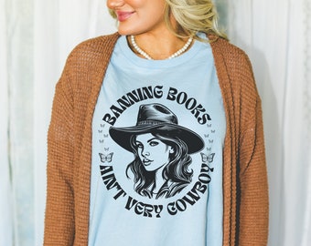 Funny Bookish Tee for Cool Librarian: Banning Books Ain't Very Cowboy | Silly Western Cowgirl Aesthetic T-Shirt for Reader, Bookworm Gift