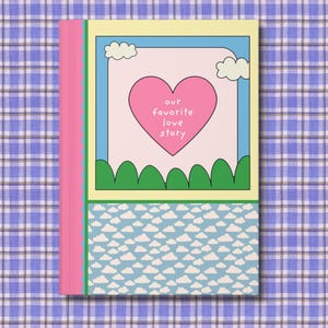 May include: A pink and green book with the text "our favorite love story" on the cover. The cover features a pink heart, green hills, and blue sky with clouds. The book is set against a blue and white plaid background.