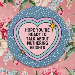 May include: A blue and pink heart-shaped sticker with the text "HOPE YOU'RE READY TO TALK ABOUT WUthering HEIGHTS" in white.