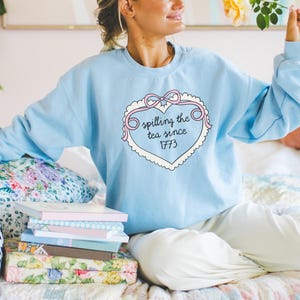 American History Social Studies Teacher Sweatshirt for Fourth of July: Spilling the Tea Since 1773, Cute Boho US History Crewneck with Heart