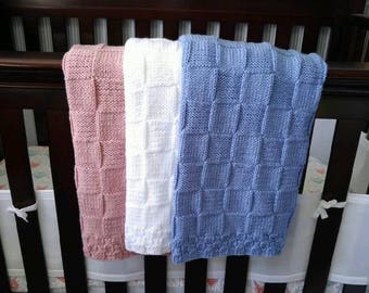 Hand knitted baby blanket, in a variety of colors.