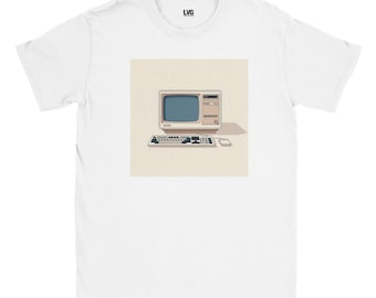May include: White t-shirt featuring a retro computer graphic. The design includes a vintage computer monitor, keyboard, and mouse in a minimalist style. The shirt has a crew neck and short sleeves, with the brand logo "LVG" at the top.