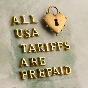 the text "ALL USA TARIFFS ARE PREPAID" in a stylized font, with a heart-shaped lock symbol above the text.