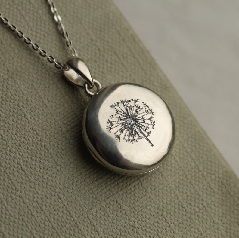 sterling silver personalised locket with botanical engraving of dandelion flower