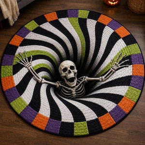 May include: A round rug featuring a 3D optical illusion of a black and white swirling vortex. A human skeleton is positioned in the center with arms outstretched. The border consists of alternating orange, purple, and green quilted squares.