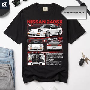 May include: A black short-sleeve t-shirt featuring a graphic print of a white Nissan 240SX car from multiple angles, including the front, rear, and engine bay, accompanied by red geometric accents and detailed Japanese text specifications.