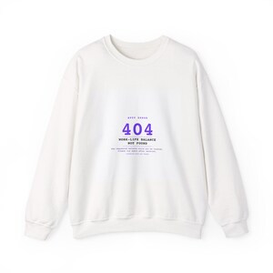 May include: A white long-sleeve sweatshirt featuring a purple and black graphic print on the chest. The text reads HTTP ERROR 404 WORK-LIFE BALANCE NOT FOUND, followed by smaller text stating the requested balance could not be located.