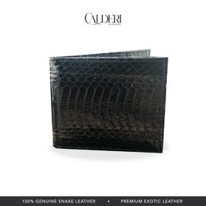 May include: A black bi-fold wallet made of genuine snake leather. The wallet has a textured, scale-like pattern and a glossy finish. The brand name "CALDERI" is visible at the top.