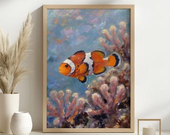 May include: A framed painting of a clownfish swimming near coral. The fish is orange with white stripes and black accents. The coral is a mix of pink and brown, set against a blue and light blue background.