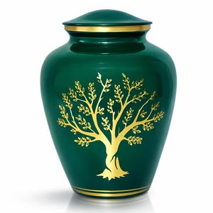 Könnte beinhalten: Smaragdgrüne Urne mit goldenem Lebensbaum-Design. Die Urne hat eine runde Form mit Deckel und goldenen Verzierungen. Das Baumdesign befindet sich mittig auf dem Urnenkörper.