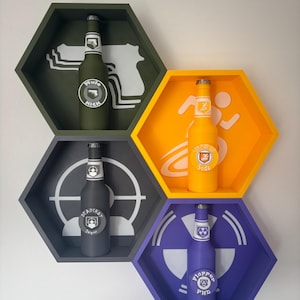 May include: Four hexagonal wall shelves in olive green, yellow, grey, and purple, each holding a bottle with a unique label. The shelves have white graphic designs. The bottles have silver bottle caps.