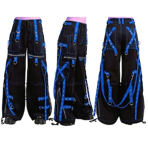 May include: Black cargo pants with multiple pockets, zippers, and blue straps. The pants have a wide leg design and feature silver metal hardware. The blue straps crisscross the front and back of the pants, adding a unique visual element.