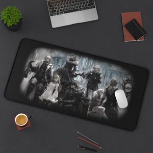 May include: Black rectangular mousepad featuring a grayscale illustration of a group of characters in a fantasy setting. The image has a white border and is surrounded by a black surface. A computer mouse is on the right side of the mousepad.