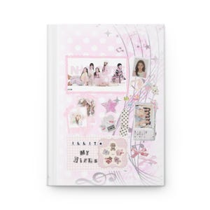 May include: A white journal with a pink cover. The cover features a collage of images, including a group photo of six people, individual portraits, and decorative elements like stars and bows. The text "ILLIT My Girls" is visible.