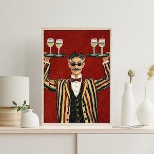 Może przedstawiać: Biały ceramiczny kubek z czarnym uchwytem i napisem "But First, Coffee" pogrubioną czcionką. Kubek jest umieszczony na rozmytym tle, sugerującym przytulne otoczenie.