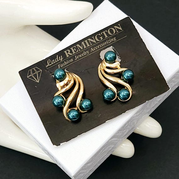 Vintage Lady REMINGTON 1980s Swirl Clip Earrings with… Gem