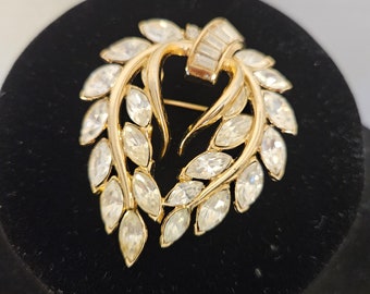 Vintage CROWN TRIFARI Swag Wreath Brooch with Clear Baguette Marquise Rhinestones in a Gold Tone Setting