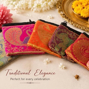 May include: A collection of six small, rectangular fabric pouches featuring vibrant colors including pink, orange, maroon, and red. Each pouch displays intricate woven patterns of elephants, peacocks, and circular mandalas with gold-toned thread accents.