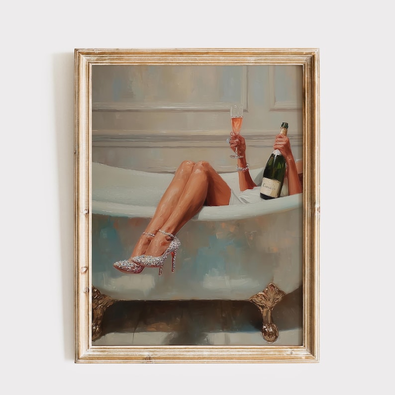 May include: An oil painting in a gold frame depicts a person relaxing in a clawfoot bathtub with a champagne bottle and a glass of champagne. The person wears sparkling high heels. The artwork has a vintage, luxurious theme.