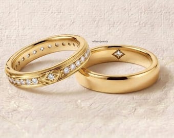 May include: Two gold rings, one featuring a row of small round clear stones and a central diamond-shaped accent, and the other a plain polished gold band with a single small diamond-shaped inlay. The text wilsonjewels is visible in the center.