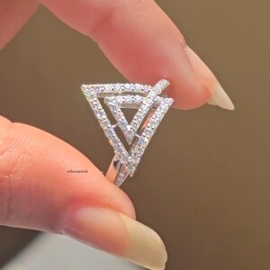 triangle diamond ring
geometric ring
white gold ring
open triangle ring
modern statement ring
minimalist jewelry
pave diamond ring
unique engagement ring
anniversary gift
luxury ring
architectural ring
gift for her
modern bridal ring
triangle ring
geometric jewelry
open design ring
pave diamond ring
white gold jewelry
modern gold ring
statement jewelry
minimalist ring
contemporary ring
architectural ring
unique ring design
fashion ring
gift for women
anniversary jewelry
bridal statement ring