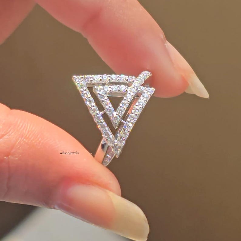 triangle diamond ring
geometric ring
white gold ring
open triangle ring
modern statement ring
minimalist jewelry
pave diamond ring
unique engagement ring
anniversary gift
luxury ring
architectural ring
gift for her
modern bridal ring
triangle ring
geometric jewelry
open design ring
pave diamond ring
white gold jewelry
modern gold ring
statement jewelry
minimalist ring
contemporary ring
architectural ring
unique ring design
fashion ring
gift for women
anniversary jewelry
bridal statement ring