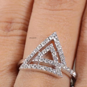 triangle diamond ring
geometric ring
white gold ring
open triangle ring
modern statement ring
minimalist jewelry
pave diamond ring
unique engagement ring
anniversary gift
luxury ring
architectural ring
gift for her
modern bridal ring
triangle ring
geometric jewelry
open design ring
pave diamond ring
white gold jewelry
modern gold ring
statement jewelry
minimalist ring
contemporary ring
architectural ring
unique ring design
fashion ring
gift for women
anniversary jewelry
bridal statement ring