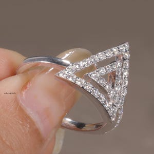 triangle diamond ring
geometric ring
white gold ring
open triangle ring
modern statement ring
minimalist jewelry
pave diamond ring
unique engagement ring
anniversary gift
luxury ring
architectural ring
gift for her
modern bridal ring
triangle ring
geometric jewelry
open design ring
pave diamond ring
white gold jewelry
modern gold ring
statement jewelry
minimalist ring
contemporary ring
architectural ring
unique ring design
fashion ring
gift for women
anniversary jewelry
bridal statement ring