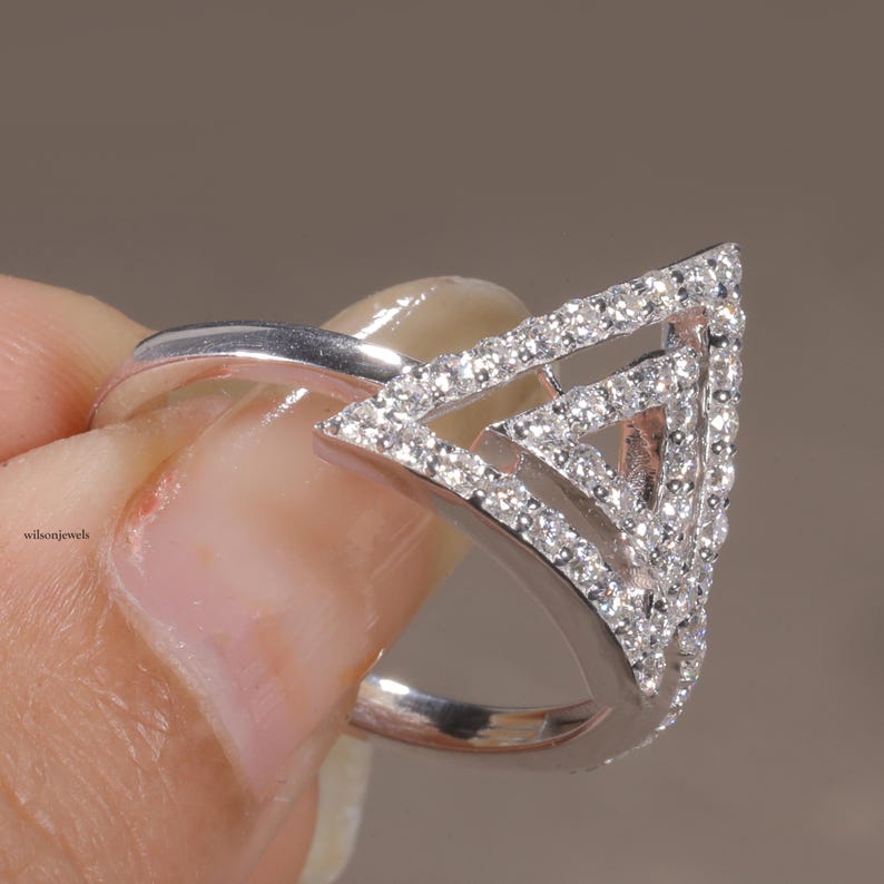 triangle diamond ring
geometric ring
white gold ring
open triangle ring
modern statement ring
minimalist jewelry
pave diamond ring
unique engagement ring
anniversary gift
luxury ring
architectural ring
gift for her
modern bridal ring
triangle ring
geometric jewelry
open design ring
pave diamond ring
white gold jewelry
modern gold ring
statement jewelry
minimalist ring
contemporary ring
architectural ring
unique ring design
fashion ring
gift for women
anniversary jewelry
bridal statement ring