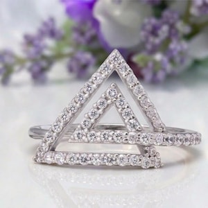 triangle diamond ring
geometric ring
white gold ring
open triangle ring
modern statement ring
minimalist jewelry
pave diamond ring
unique engagement ring
anniversary gift
luxury ring
architectural ring
gift for her
modern bridal ring
triangle ring
geometric jewelry
open design ring
pave diamond ring
white gold jewelry
modern gold ring
statement jewelry
minimalist ring
contemporary ring
architectural ring
unique ring design
fashion ring
gift for women
anniversary jewelry
bridal statement ring