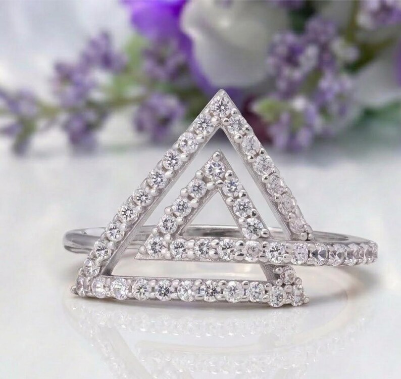 triangle diamond ring
geometric ring
white gold ring
open triangle ring
modern statement ring
minimalist jewelry
pave diamond ring
unique engagement ring
anniversary gift
luxury ring
architectural ring
gift for her
modern bridal ring
triangle ring
geometric jewelry
open design ring
pave diamond ring
white gold jewelry
modern gold ring
statement jewelry
minimalist ring
contemporary ring
architectural ring
unique ring design
fashion ring
gift for women
anniversary jewelry
bridal statement ring
