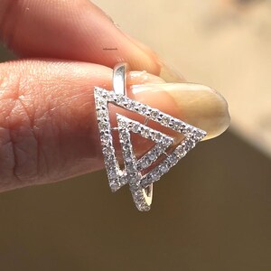triangle diamond ring
geometric ring
white gold ring
open triangle ring
modern statement ring
minimalist jewelry
pave diamond ring
unique engagement ring
anniversary gift
luxury ring
architectural ring
gift for her
modern bridal ring
triangle ring
geometric jewelry
open design ring
pave diamond ring
white gold jewelry
modern gold ring
statement jewelry
minimalist ring
contemporary ring
architectural ring
unique ring design
fashion ring
gift for women
anniversary jewelry
bridal statement ring