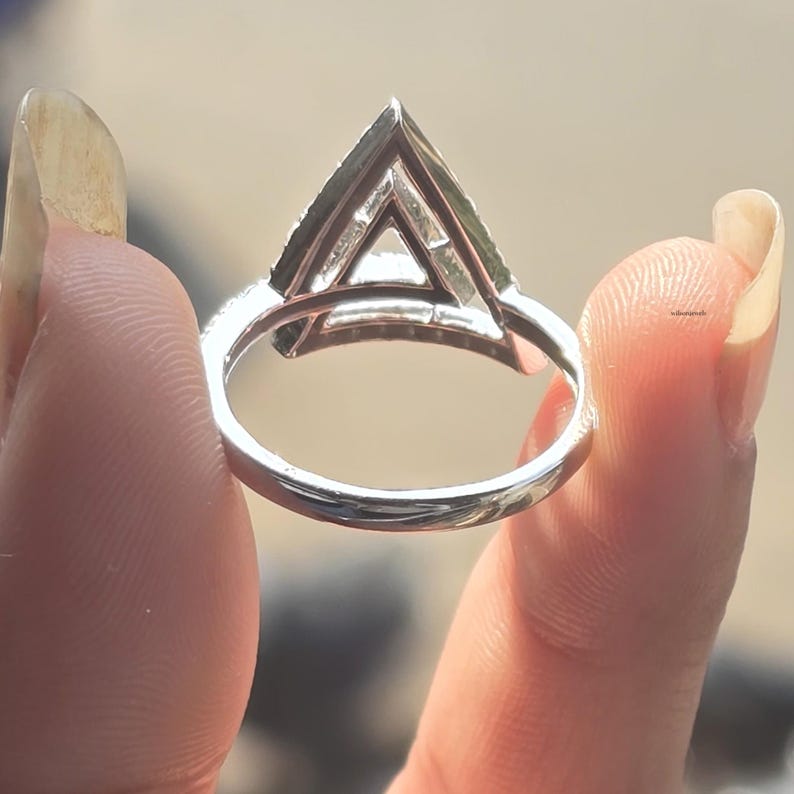 triangle diamond ring
geometric ring
white gold ring
open triangle ring
modern statement ring
minimalist jewelry
pave diamond ring
unique engagement ring
anniversary gift
luxury ring
architectural ring
gift for her
modern bridal ring
triangle ring
geometric jewelry
open design ring
pave diamond ring
white gold jewelry
modern gold ring
statement jewelry
minimalist ring
contemporary ring
architectural ring
unique ring design
fashion ring
gift for women
anniversary jewelry
bridal statement ring