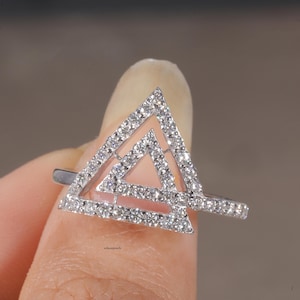 triangle diamond ring
geometric ring
white gold ring
open triangle ring
modern statement ring
minimalist jewelry
pave diamond ring
unique engagement ring
anniversary gift
luxury ring
architectural ring
gift for her
modern bridal ring
triangle ring
geometric jewelry
open design ring
pave diamond ring
white gold jewelry
modern gold ring
statement jewelry
minimalist ring
contemporary ring
architectural ring
unique ring design
fashion ring
gift for women
anniversary jewelry
bridal statement ring