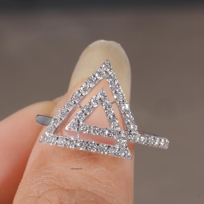 triangle diamond ring
geometric ring
white gold ring
open triangle ring
modern statement ring
minimalist jewelry
pave diamond ring
unique engagement ring
anniversary gift
luxury ring
architectural ring
gift for her
modern bridal ring
triangle ring
geometric jewelry
open design ring
pave diamond ring
white gold jewelry
modern gold ring
statement jewelry
minimalist ring
contemporary ring
architectural ring
unique ring design
fashion ring
gift for women
anniversary jewelry
bridal statement ring