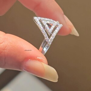 triangle diamond ring
geometric ring
white gold ring
open triangle ring
modern statement ring
minimalist jewelry
pave diamond ring
unique engagement ring
anniversary gift
luxury ring
architectural ring
gift for her
modern bridal ring
triangle ring
geometric jewelry
open design ring
pave diamond ring
white gold jewelry
modern gold ring
statement jewelry
minimalist ring
contemporary ring
architectural ring
unique ring design
fashion ring
gift for women
anniversary jewelry
bridal statement ring