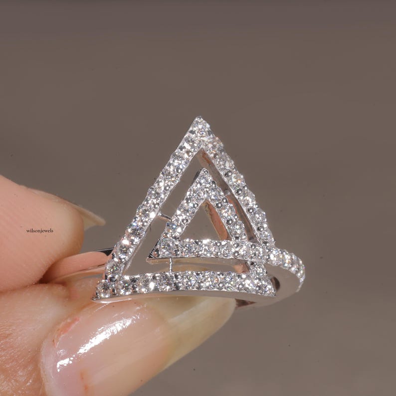 triangle diamond ring
geometric ring
white gold ring
open triangle ring
modern statement ring
minimalist jewelry
pave diamond ring
unique engagement ring
anniversary gift
luxury ring
architectural ring
gift for her
modern bridal ring
triangle ring
geometric jewelry
open design ring
pave diamond ring
white gold jewelry
modern gold ring
statement jewelry
minimalist ring
contemporary ring
architectural ring
unique ring design
fashion ring
gift for women
anniversary jewelry
bridal statement ring