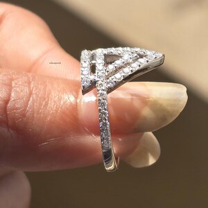 triangle diamond ring
geometric ring
white gold ring
open triangle ring
modern statement ring
minimalist jewelry
pave diamond ring
unique engagement ring
anniversary gift
luxury ring
architectural ring
gift for her
modern bridal ring
triangle ring
geometric jewelry
open design ring
pave diamond ring
white gold jewelry
modern gold ring
statement jewelry
minimalist ring
contemporary ring
architectural ring
unique ring design
fashion ring
gift for women
anniversary jewelry
bridal statement ring