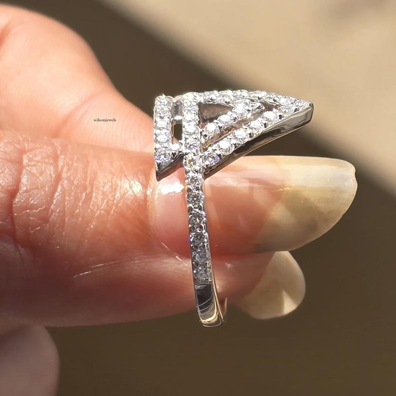 triangle diamond ring
geometric ring
white gold ring
open triangle ring
modern statement ring
minimalist jewelry
pave diamond ring
unique engagement ring
anniversary gift
luxury ring
architectural ring
gift for her
modern bridal ring
triangle ring
geometric jewelry
open design ring
pave diamond ring
white gold jewelry
modern gold ring
statement jewelry
minimalist ring
contemporary ring
architectural ring
unique ring design
fashion ring
gift for women
anniversary jewelry
bridal statement ring