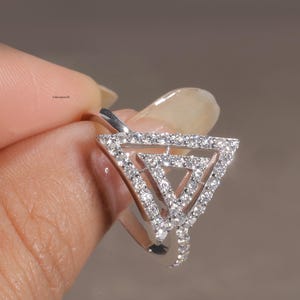 triangle diamond ring
geometric ring
white gold ring
open triangle ring
modern statement ring
minimalist jewelry
pave diamond ring
unique engagement ring
anniversary gift
luxury ring
architectural ring
gift for her
modern bridal ring
triangle ring
geometric jewelry
open design ring
pave diamond ring
white gold jewelry
modern gold ring
statement jewelry
minimalist ring
contemporary ring
architectural ring
unique ring design
fashion ring
gift for women
anniversary jewelry
bridal statement ring