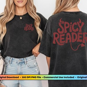 May include: A dark gray t-shirt with the text "Spicy Reader" in red on the front and back. The back design includes a devil tail. The shirt is paired with light blue denim shorts.