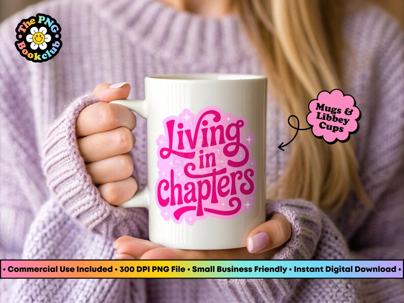 May include: A white ceramic mug featuring a vibrant pink graphic design with the text "Living in chapters" in a stylized script font, accented by small star shapes. The design is centered on the front of the mug, which has a smooth finish.