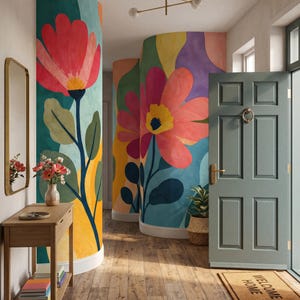 May include: A hallway featuring curved walls with a large-scale floral mural in shades of red, yellow, teal, and purple. A wooden console table holds a vase of flowers, while a sage green door with a brass knocker and a welcome mat complete the space.