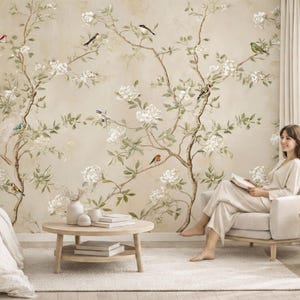 May include: A wall mural featuring a beige background with brown tree branches, white flowers, and small colorful birds. The design includes various birds perched on thin, winding branches amidst blooming white floral patterns.