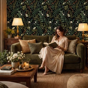 May include: Wallpaper featuring a dense botanical pattern of green ferns, white flowers, and brown pinecones set against a solid black background. The intricate design covers the entire surface with overlapping foliage and floral elements.