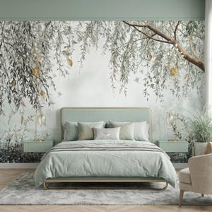 May include: A bedroom featuring a light green upholstered bed with matching bedding, flanked by two wall-mounted nightstands with glass lamps. The wall behind the bed displays a large mural of willow branches in shades of gray and muted green.