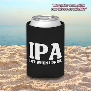 May include: A black foam can cooler featuring the white text IPA LOT WHEN I DRINK. The top of a silver aluminium can is visible protruding from the sleeve. Text at the top right reads *Regular and Slim can sizes available*.