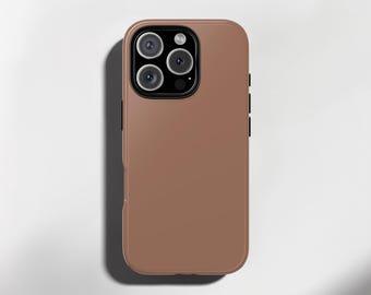 May include: A brown phone case with a camera module featuring multiple lenses. The case has a smooth, matte finish and a rectangular shape with rounded corners. The phone case is designed to protect the phone.