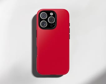 May include: A vibrant red phone case with a glossy surface. The case is rectangular with rounded corners and a camera cutout for multiple lenses. The phone case is designed to fit a smartphone.