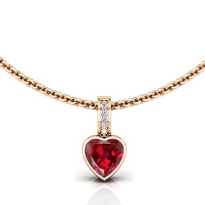 May include: A gold-colored necklace with a heart-shaped pendant. The pendant features a vibrant red gemstone set in a gold frame. Small, clear stones are set in the bail above the heart. The chain is a delicate, linked design.